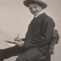 Antique photo of man sitting on chair with cigar